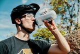 Fidlock TWIST Trinkflasche 600 ml – Set (mit Bottle Connector, mit Bike Base). Transparent